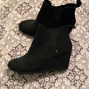 Never worn Toms wedge. Size 8.5.